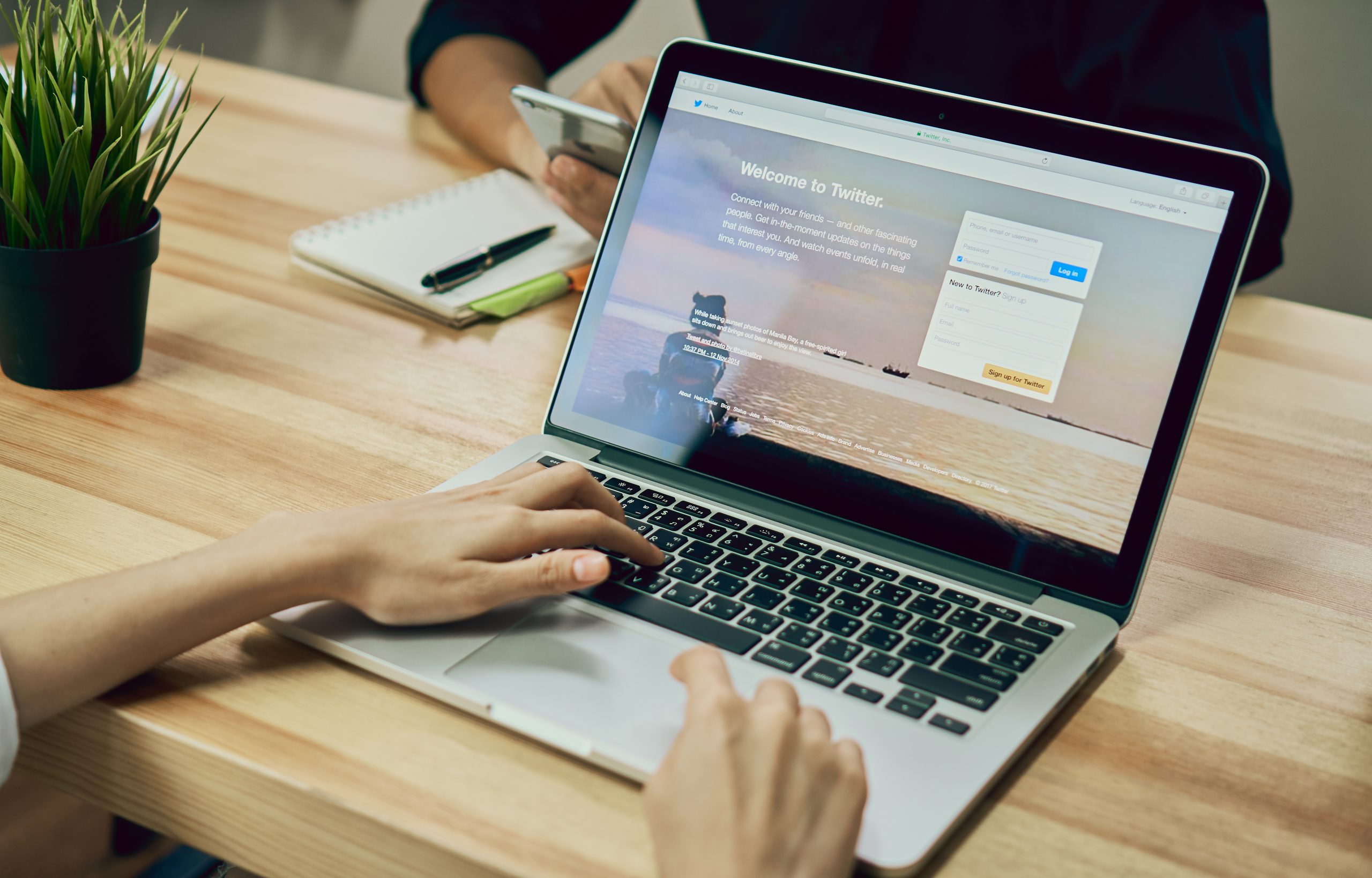 women-using-laptop-open-twitter-application