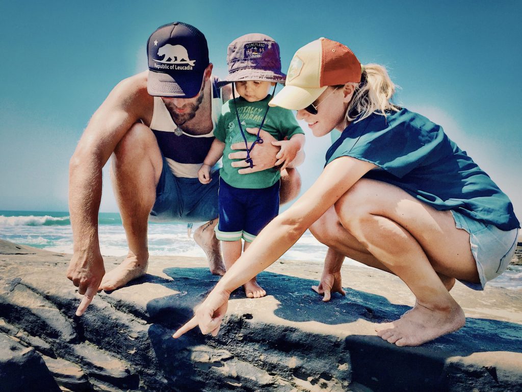cute-happy-couple-with-their-first-child-tide-pooling-in-san-diego-california-being-a-new-parent-is_t20_GRlke3