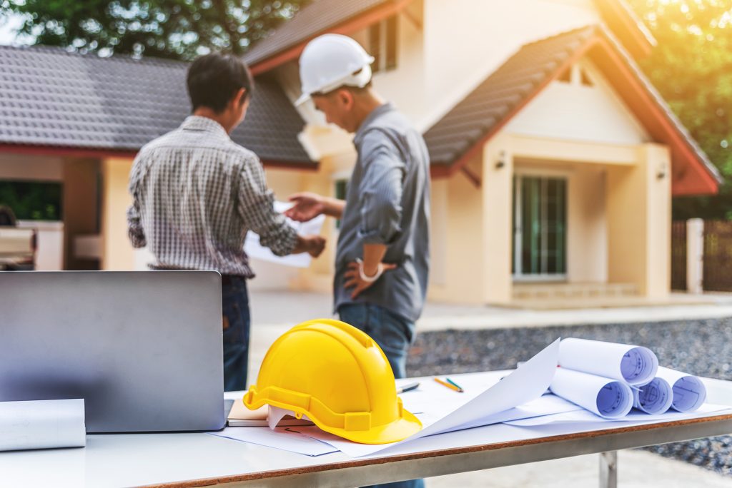 Two business man professional engineer worker at the house build